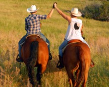 Hand hug on horseback